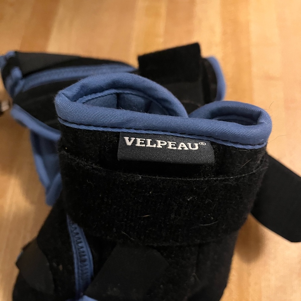 Bilateral wrist and thumb braces.